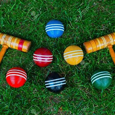 9700528-croquet-mallets-and-balls-on-grass-background-stock-photo-croquet-M175962
